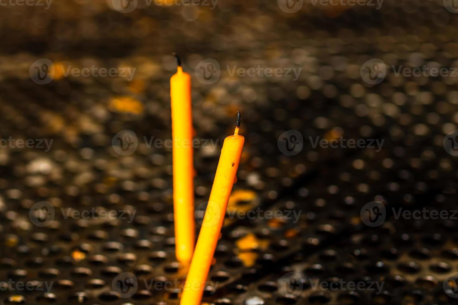 Burning melting candles in memory of the dead, close up. photo