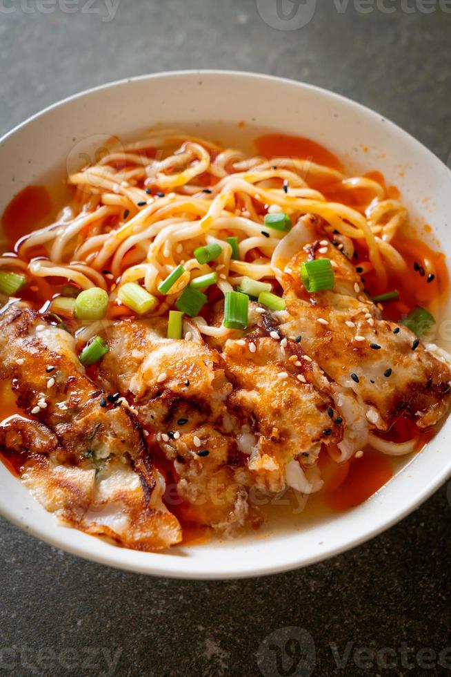 Ramen noodles with gyoza or pork dumplings photo