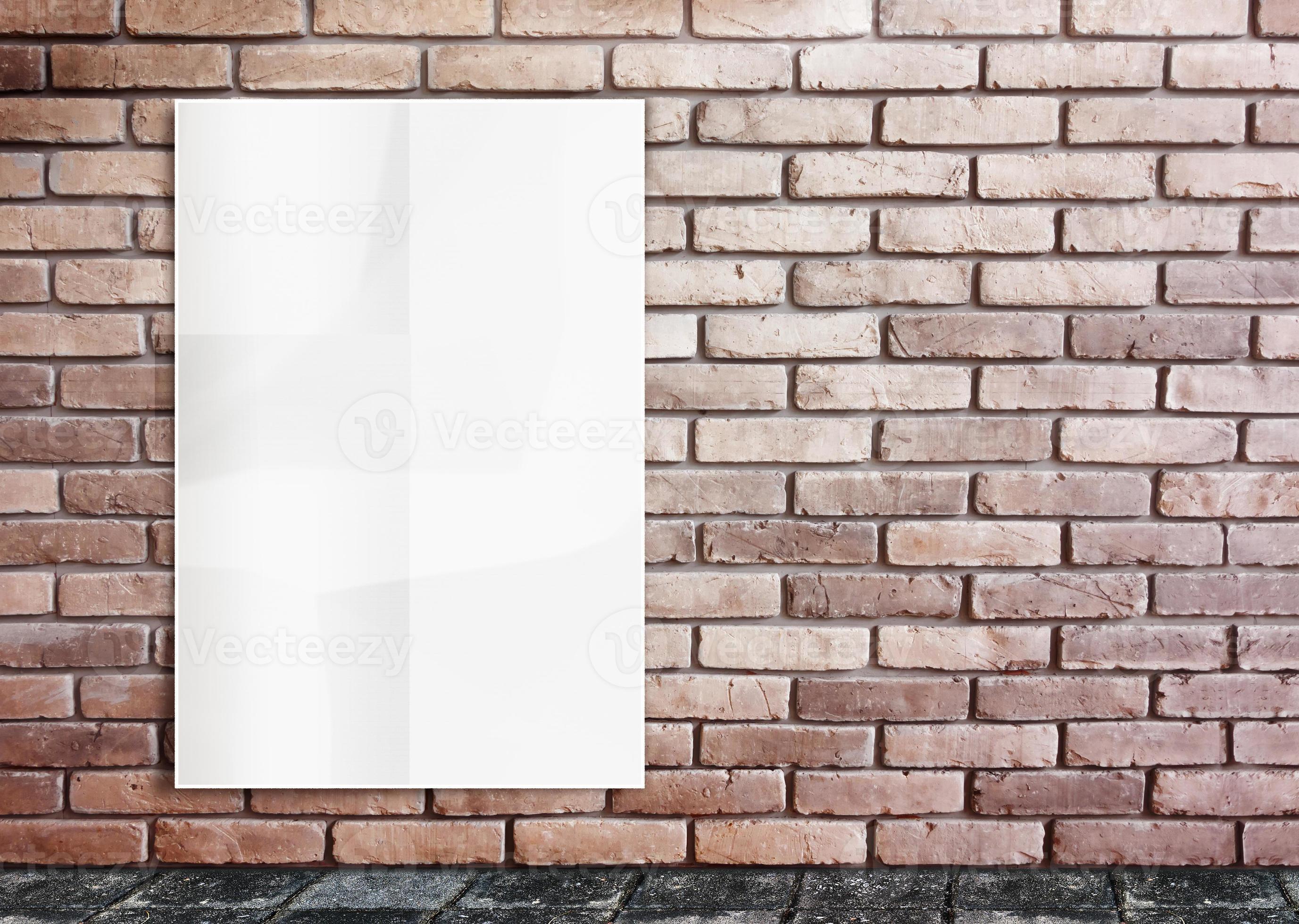 Blank poster on brick wall at street background.Mockup for design