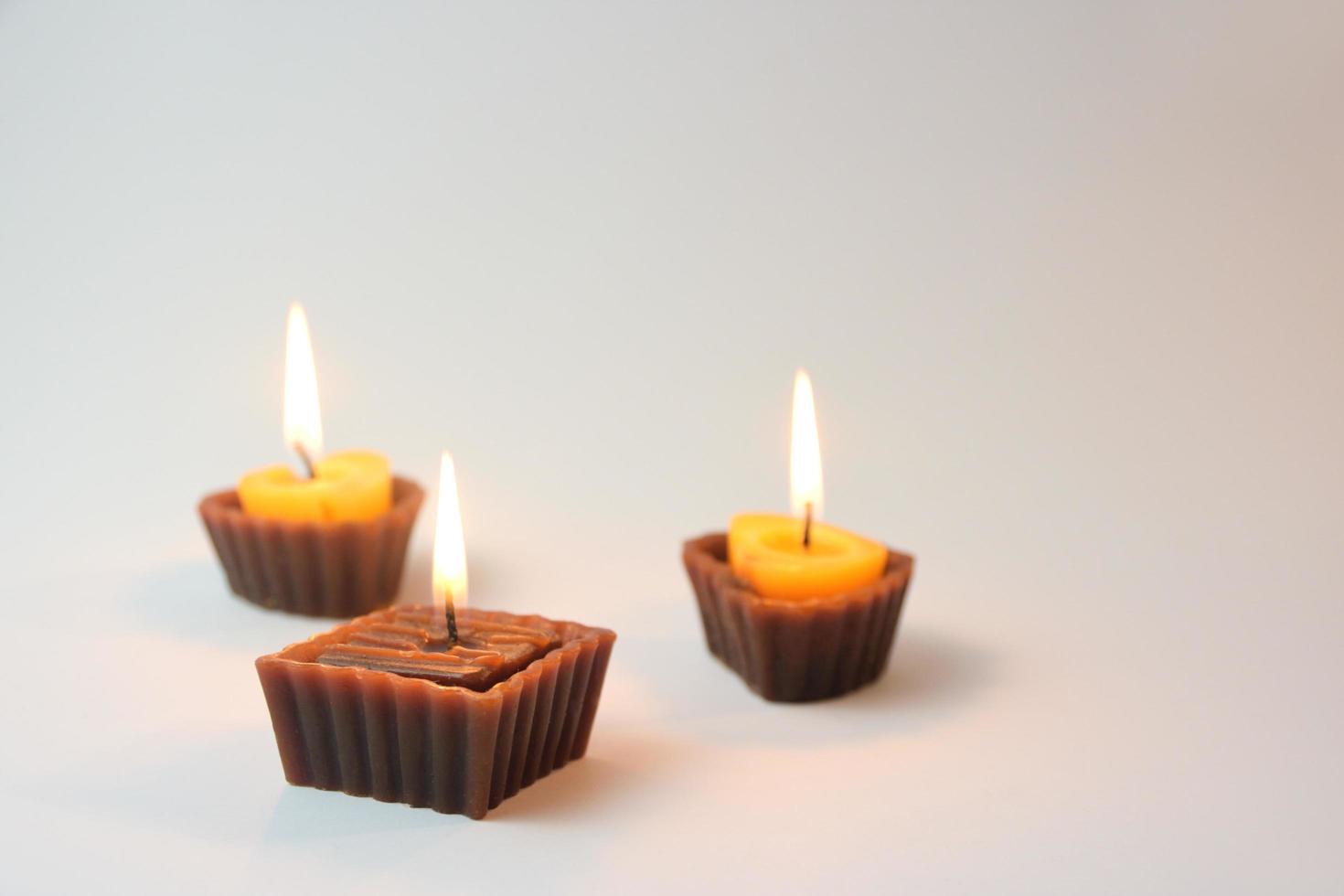 Heart-shaped candles with flames photo