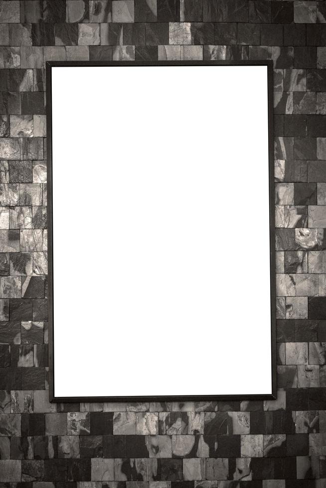 Blank billboard mockup with white screen on brick wall photo