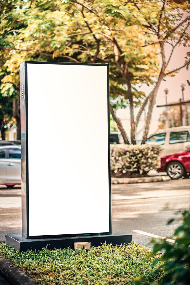 Blank billboard mockup with white screen on car parki photo