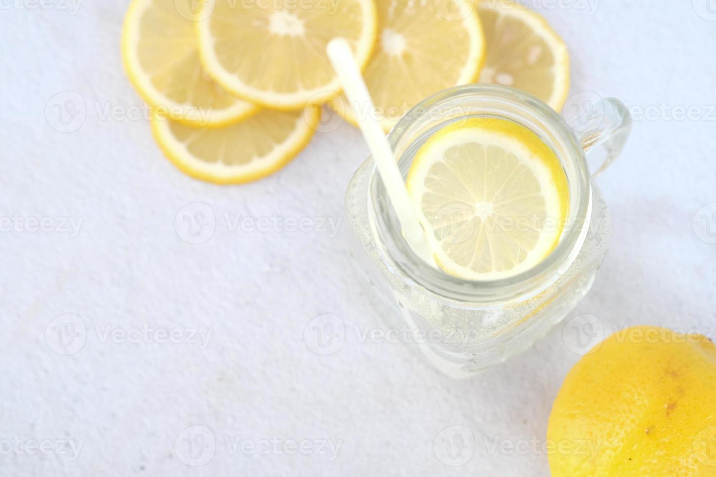 Refreshing lemon water drink on table , top view photo