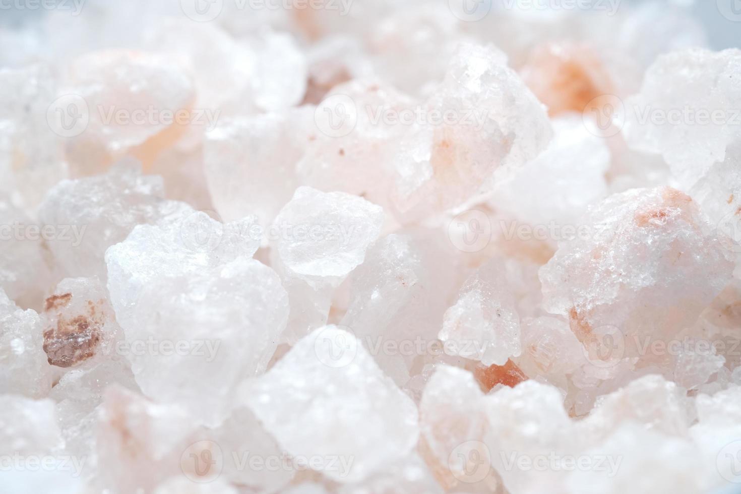 close up of pink rock salt in a bowl on table photo