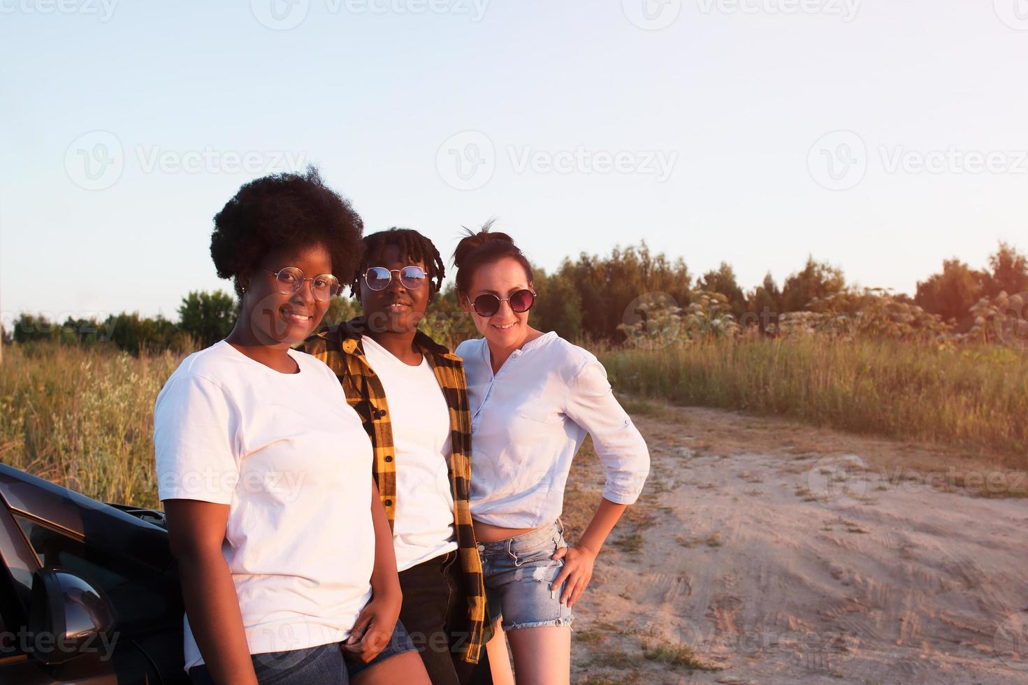 happy girls of different nationalities in the summer photo