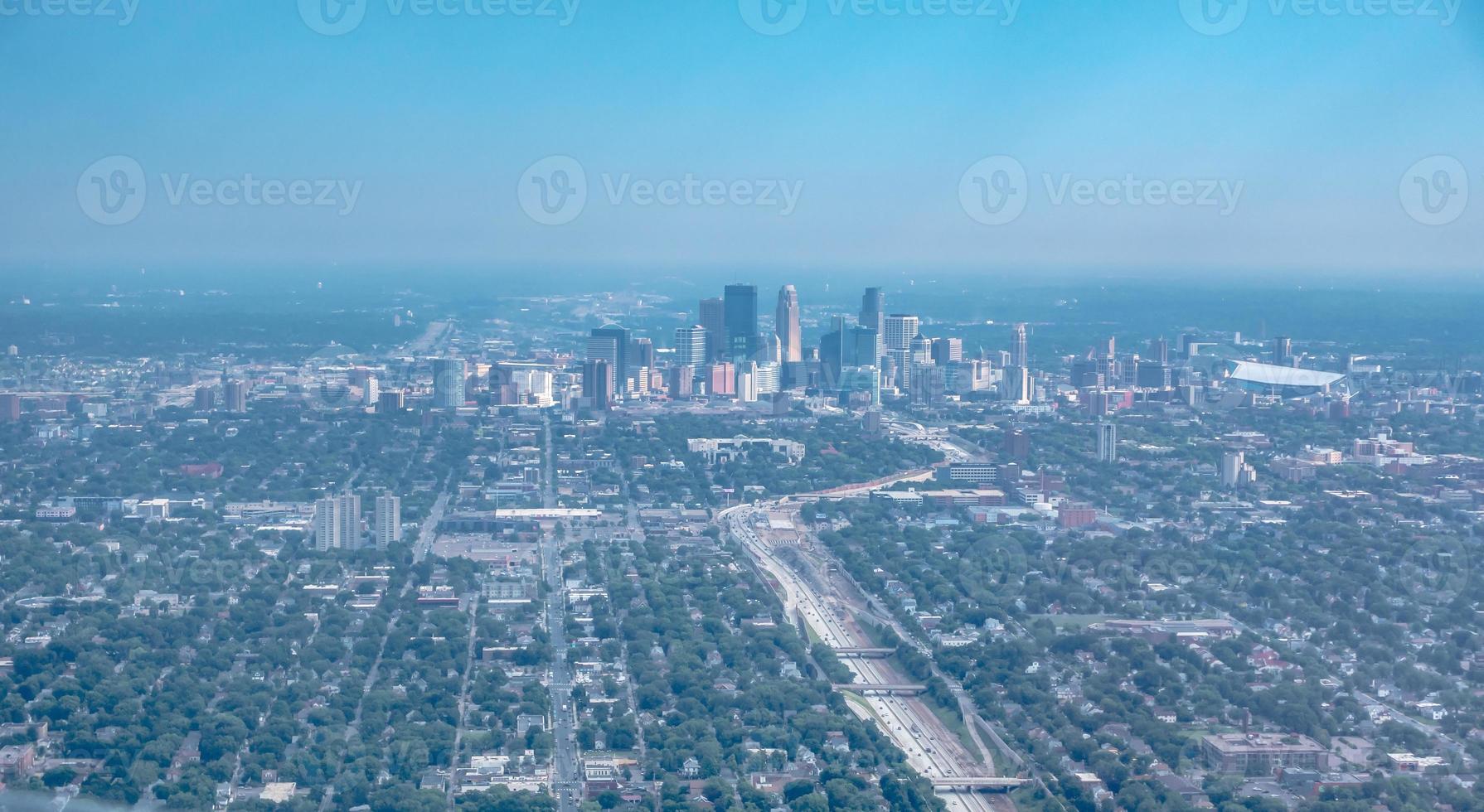 above the clouds and above minneapolis minnesota from airplane photo