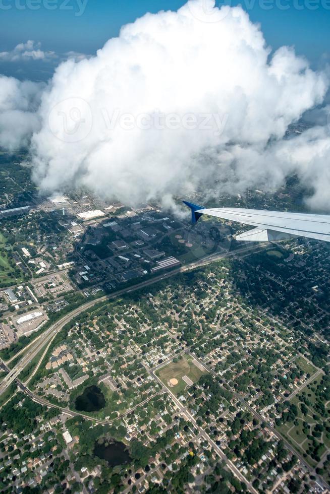 above the clouds and above minneapolis minnesota from airplane photo
