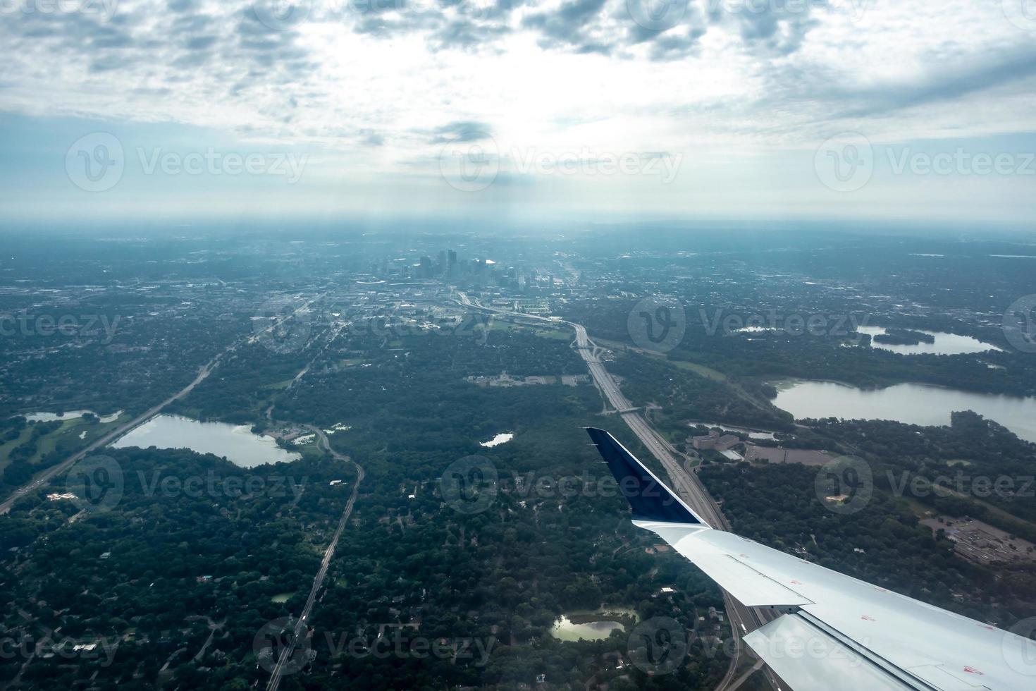 above the clouds and above minneapolis minnesota from airplane photo
