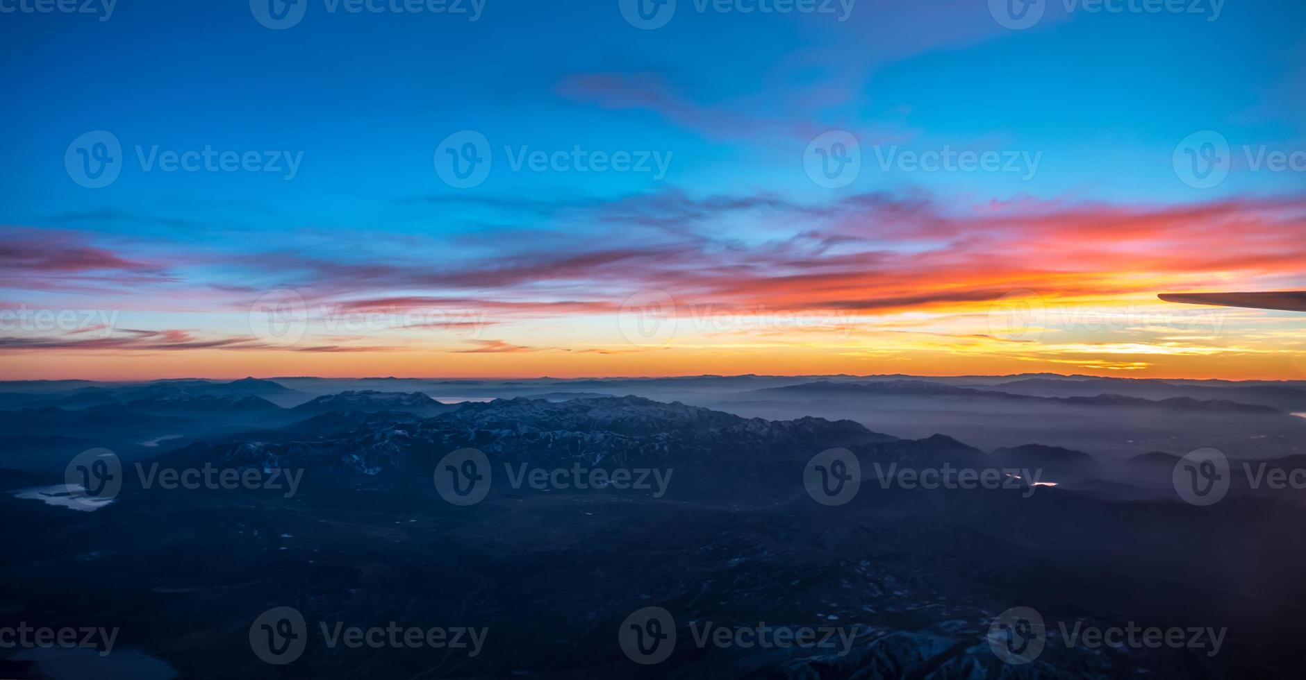 sunset over colorado rockies from an airplane photo