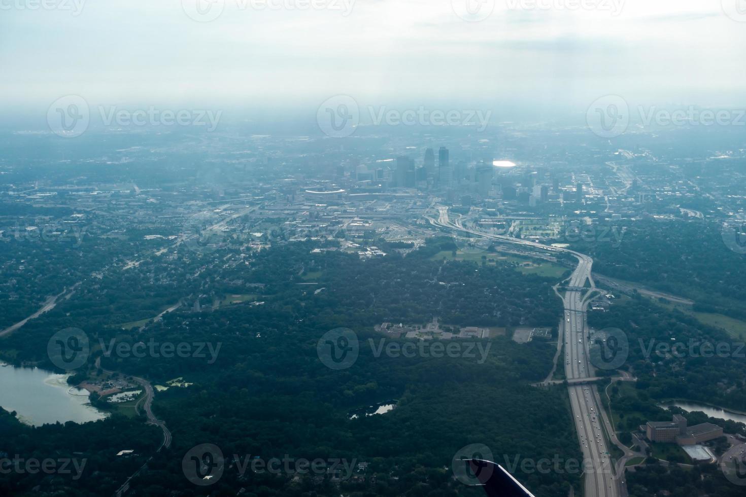 above the clouds and above minneapolis minnesota from airplane photo