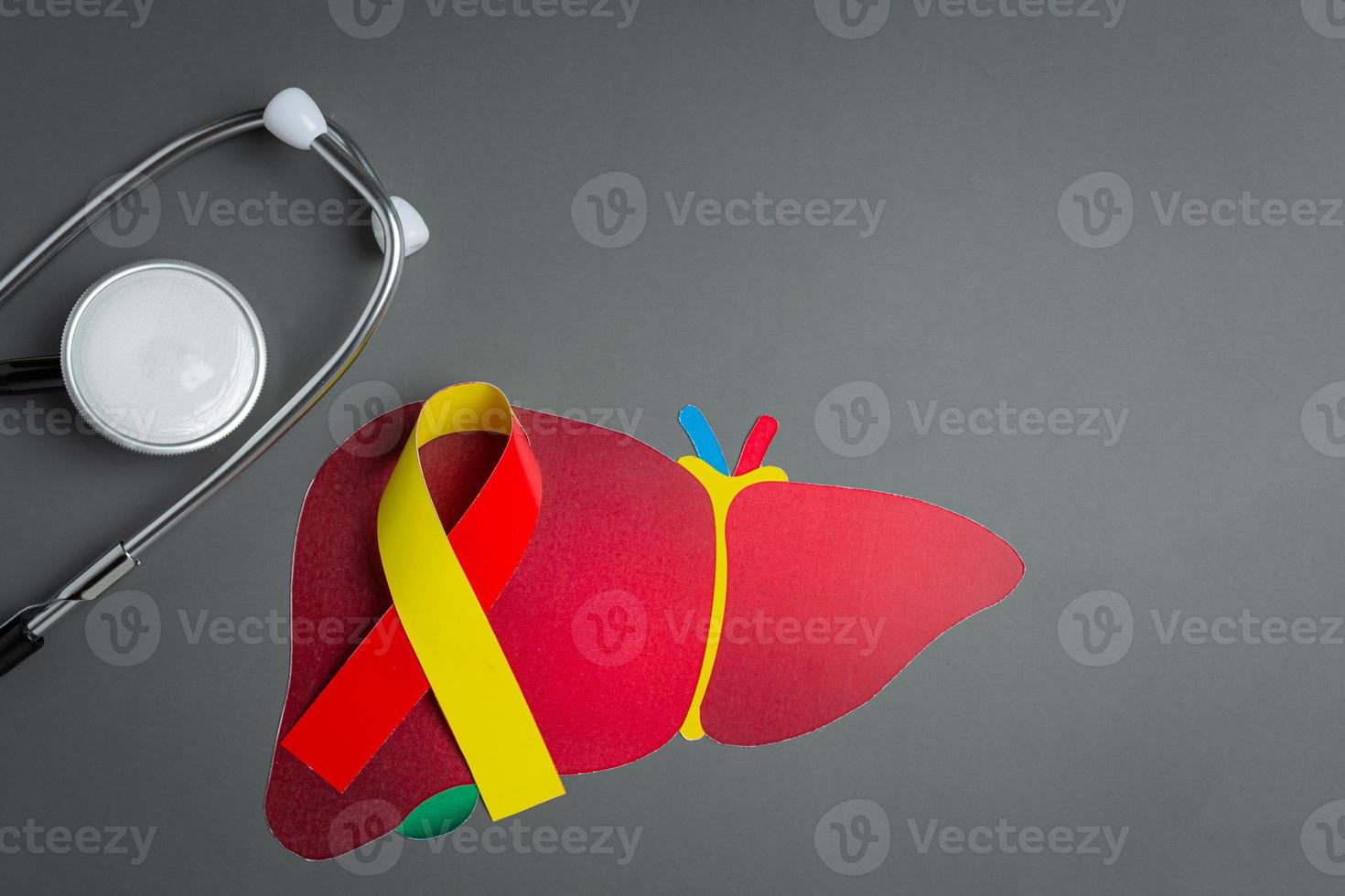 World hepatitis day awareness with red yellow ribbon photo