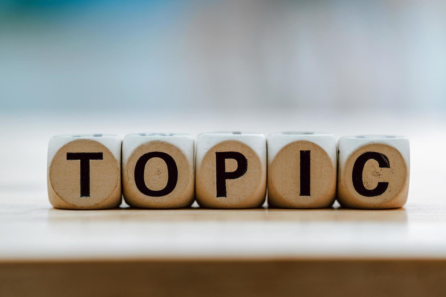 TOPIC concept with wooden block on wooden table background photo