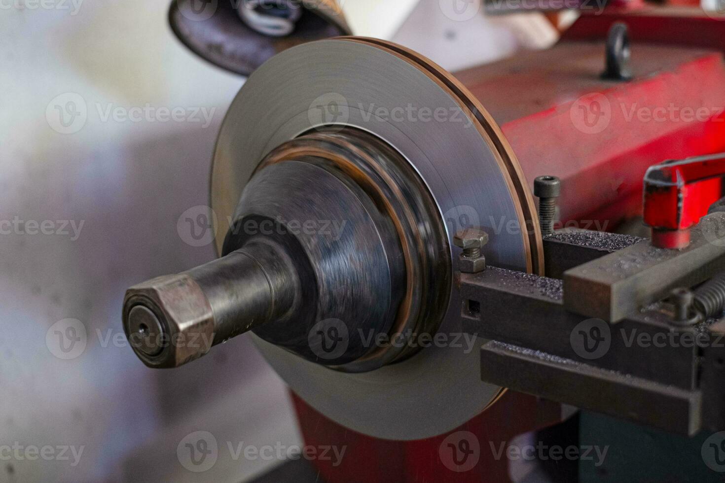 Brake lathe tool polishing disc brakes of cars working automatic photo