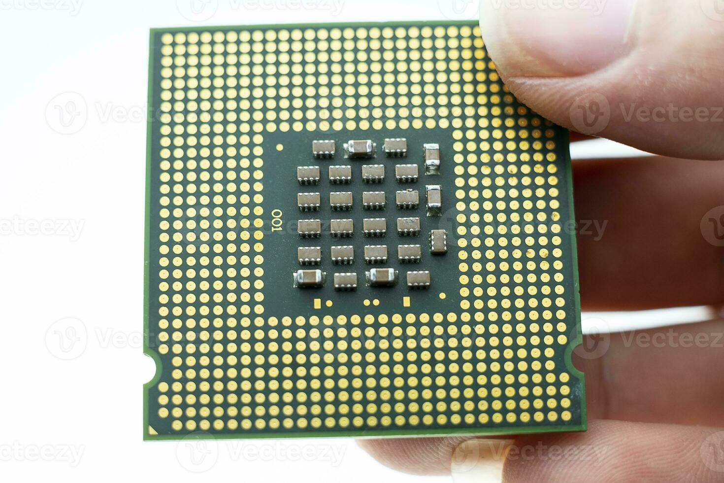 Realistic cpu back view processor chip in hand on white background photo