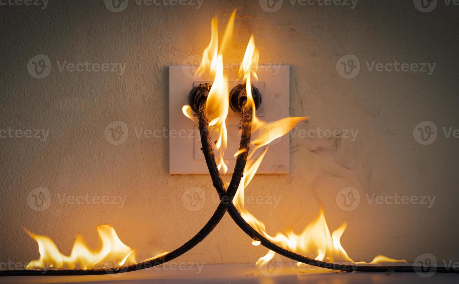 On fire electric wire plug Receptacle photo