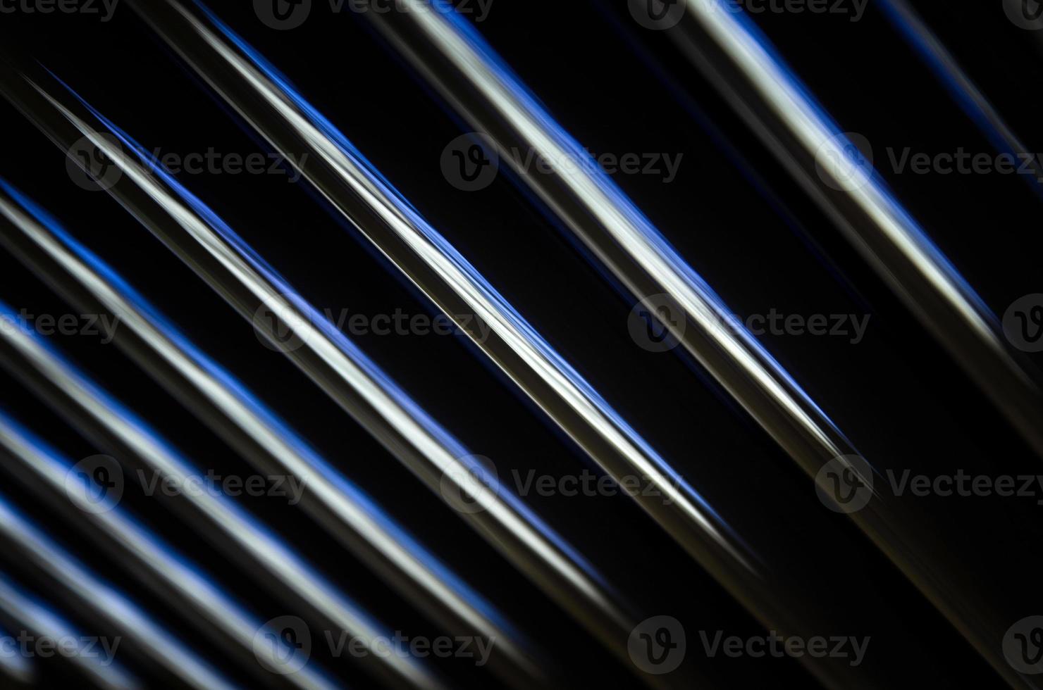 abstract dark black background with shiny metallic lines photo