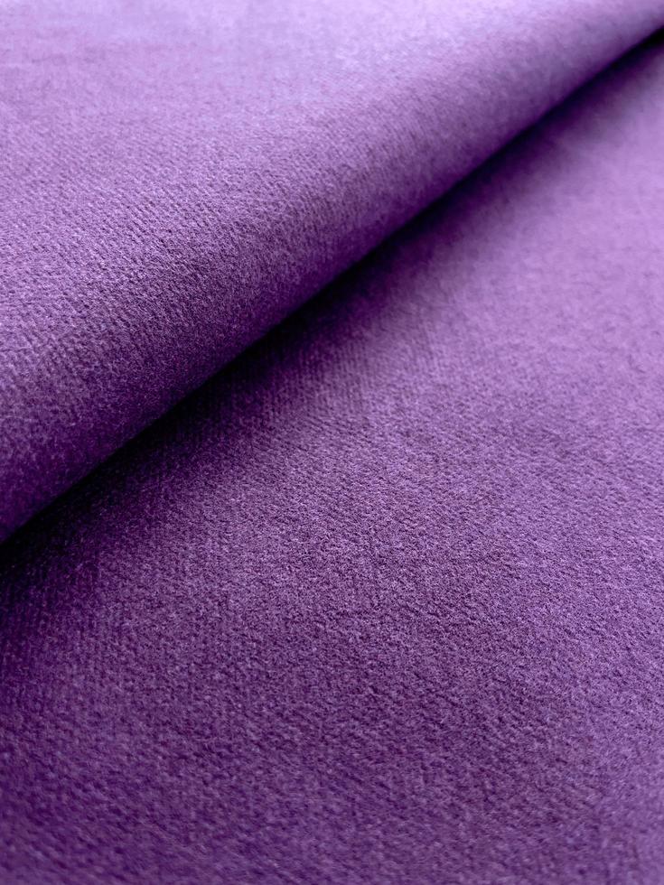 Purple color canvas texture folded fabric background photo