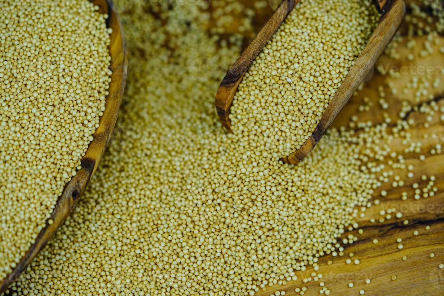 amaranth seed on olive wood photo