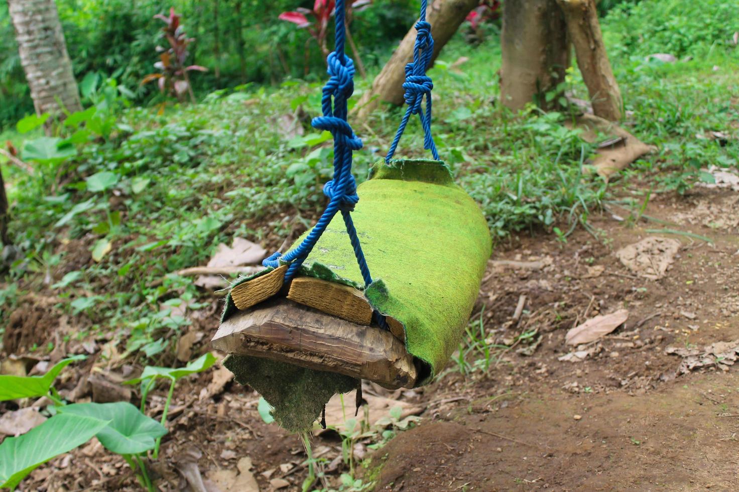 Close up of a swing, a traditional toy made from used materials photo