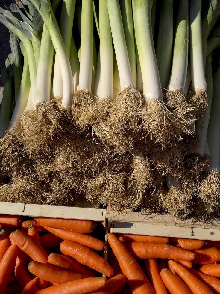 Carrots and leeks on the market photo