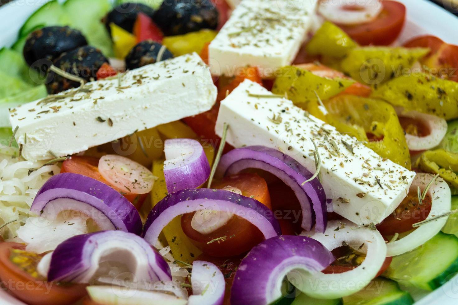 Greek salad with feta cheese olives and hot peppers photo