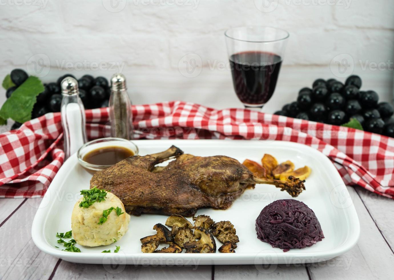 Baked Duck with red cabbage and forest mushrooms photo