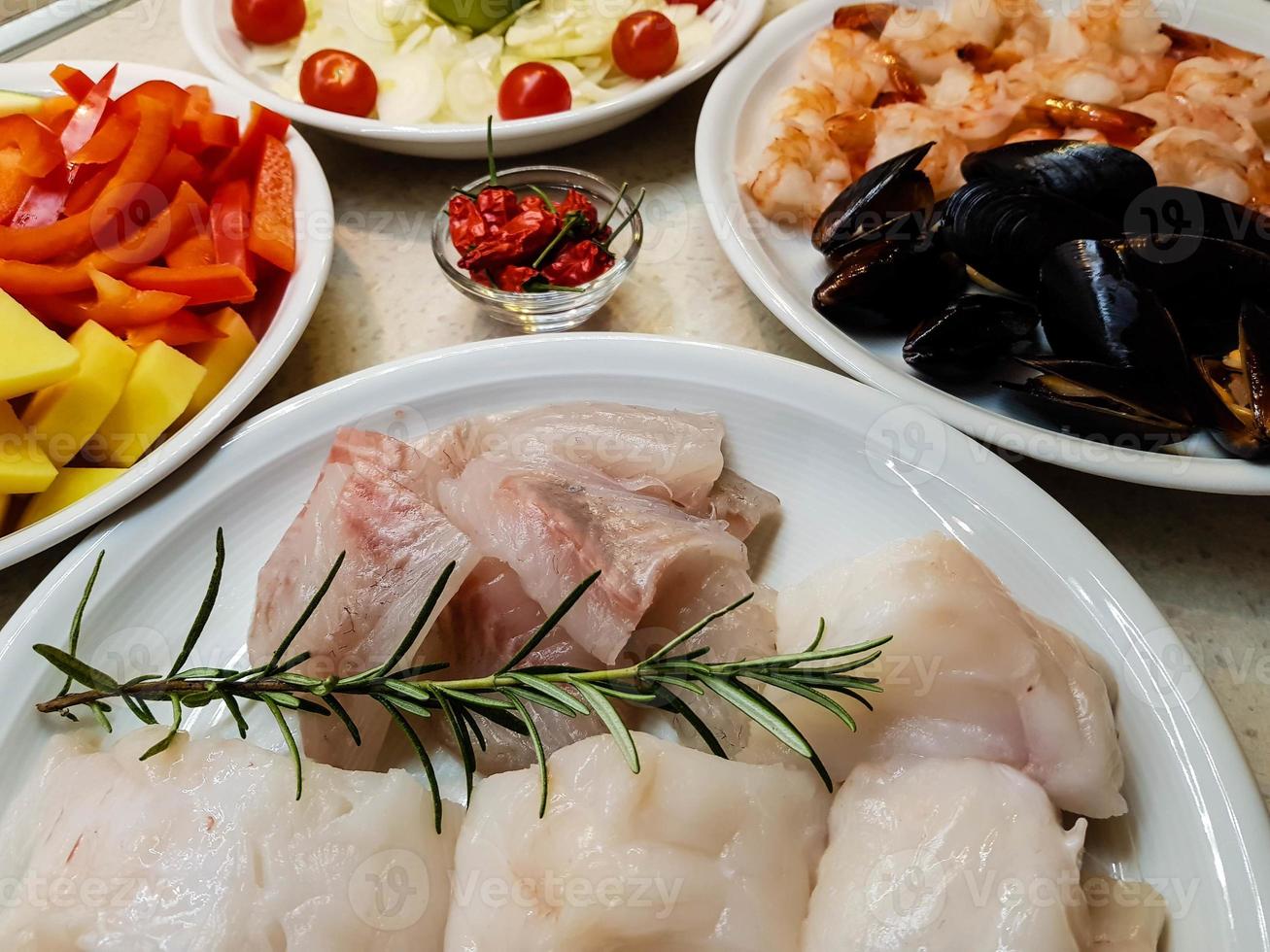 ingredients for a portuguese seafood cataplana photo