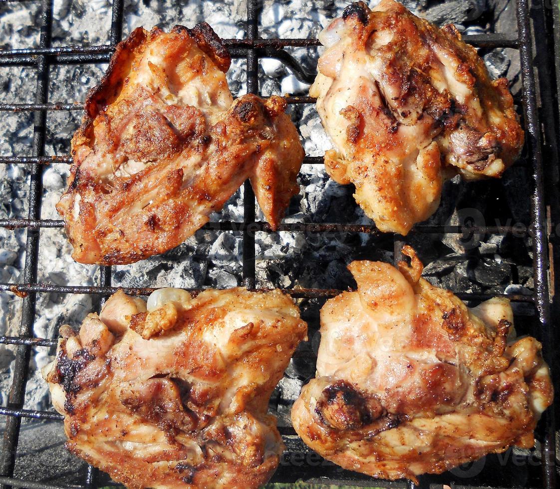 grilled chicken meat on the grill ready for eating barbeque photo