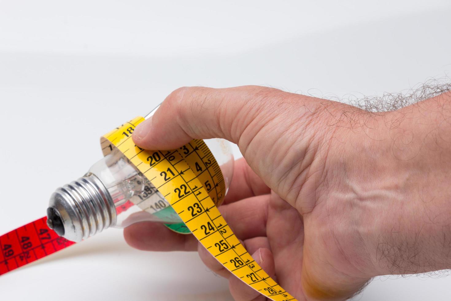 Yellow flexible tape measure photo