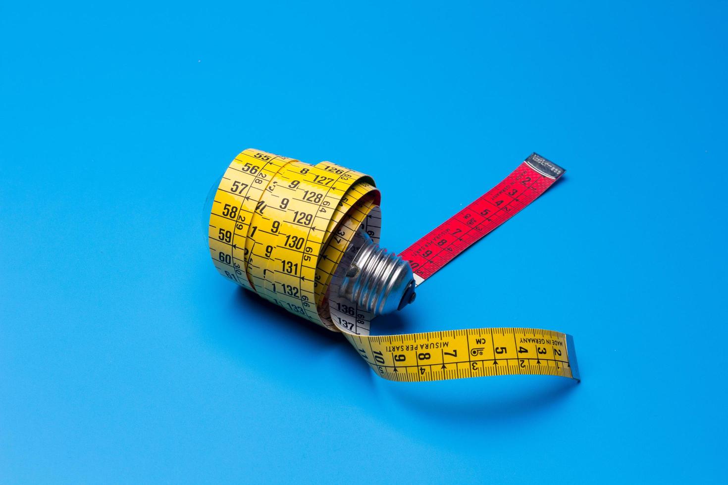 Yellow flexible tape measure photo