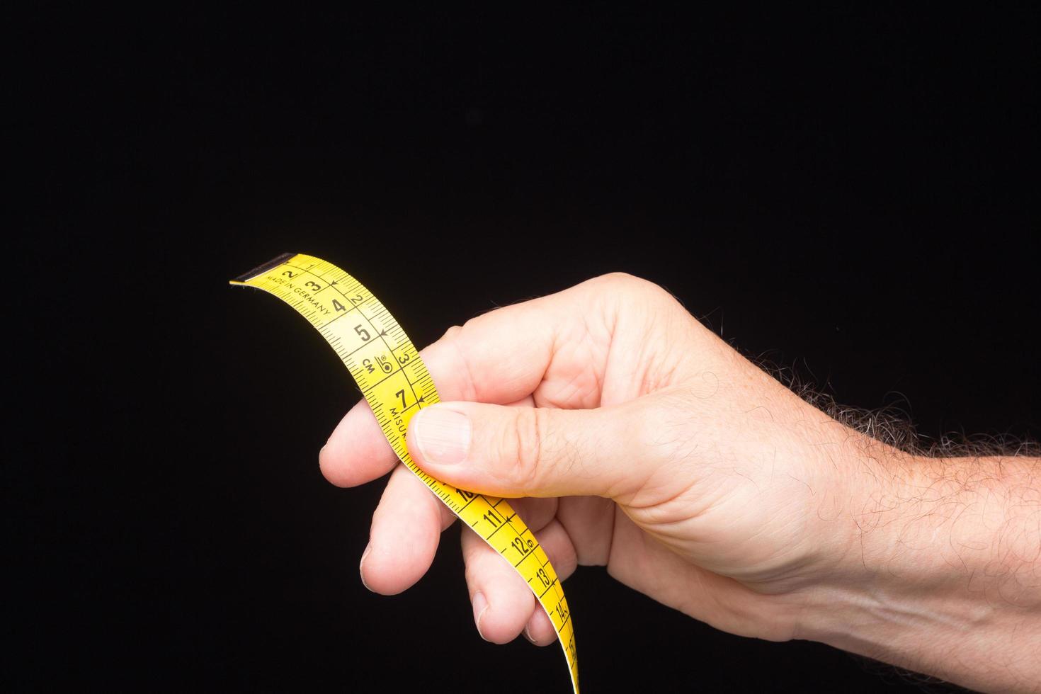 Yellow flexible tape measure photo