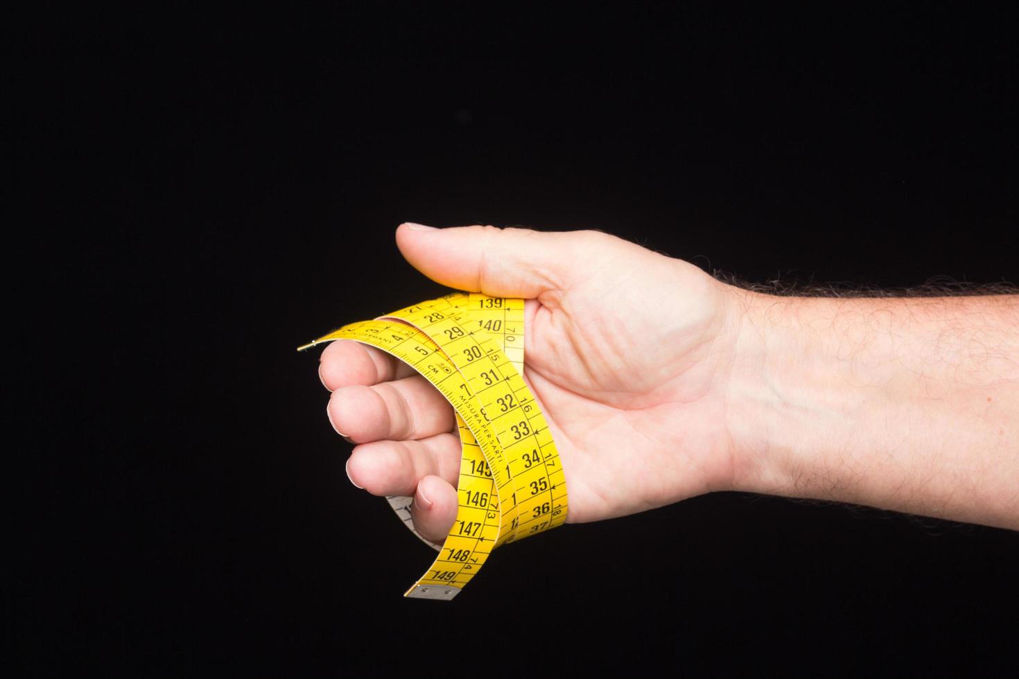 Yellow flexible tape measure photo