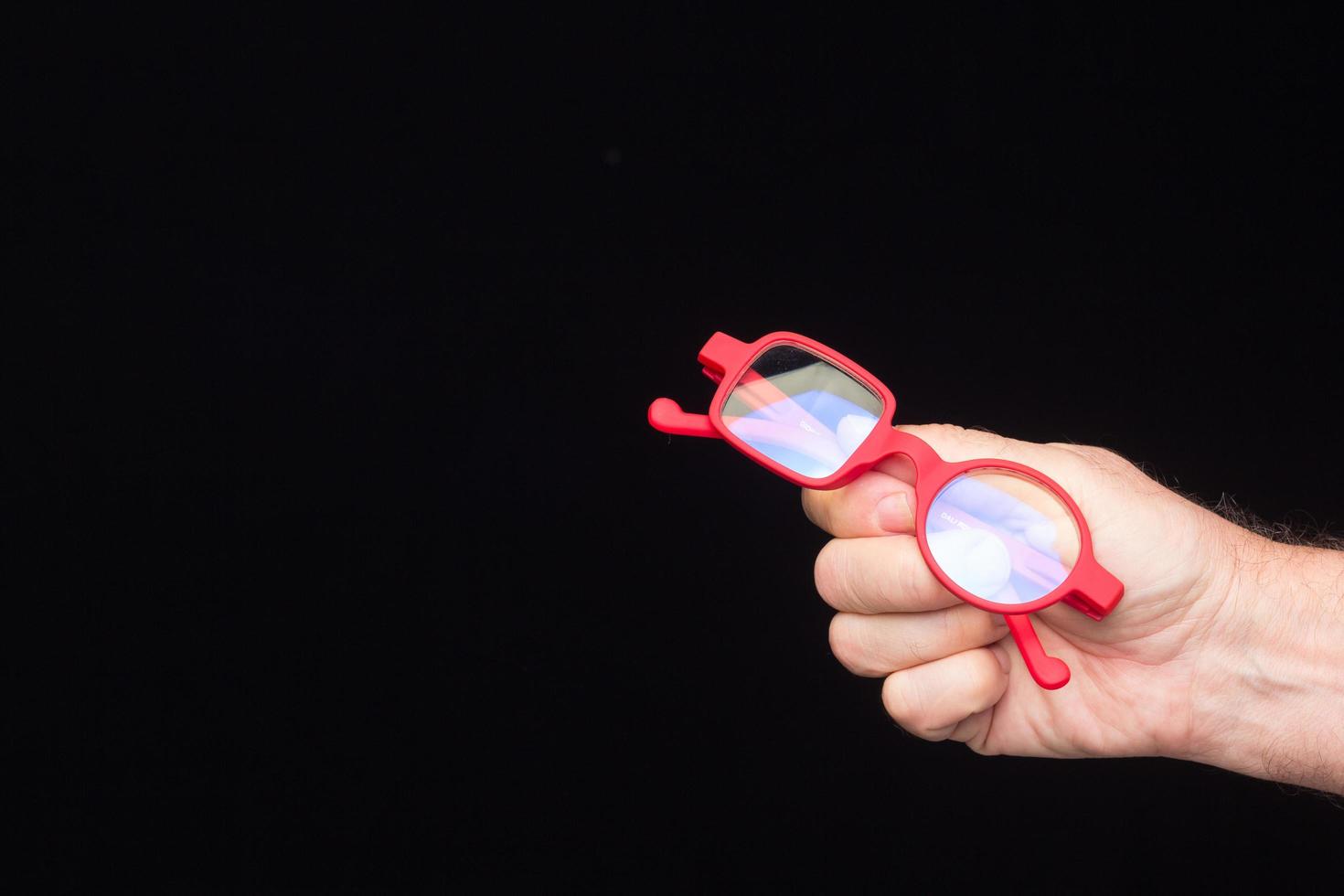 Glasses in the hand of a person photo