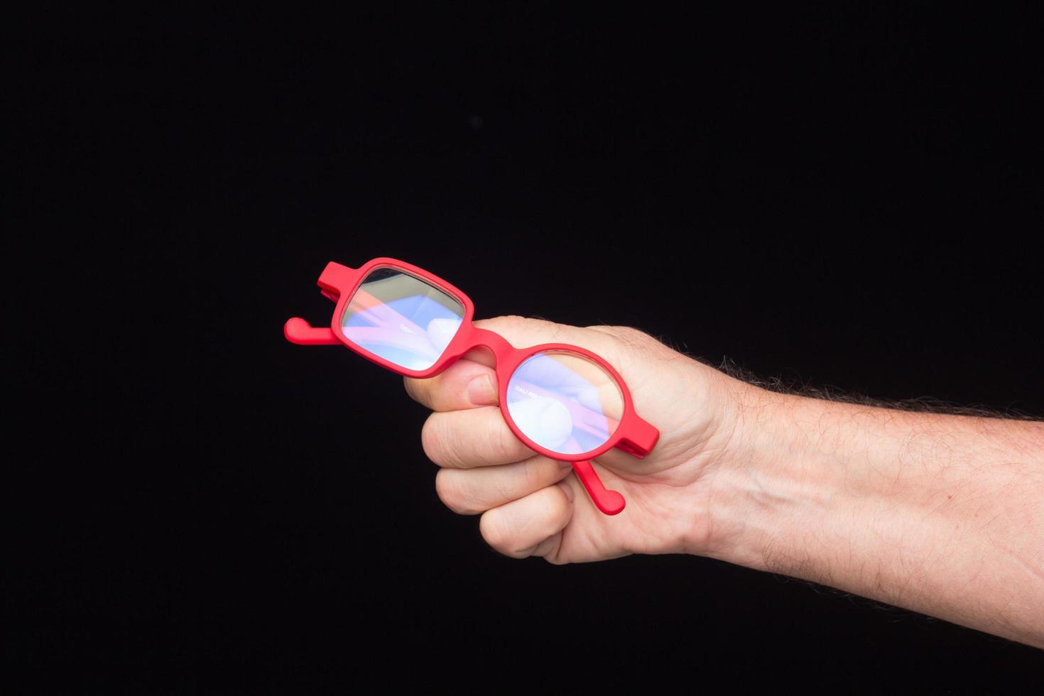 Glasses in the hand of a person photo