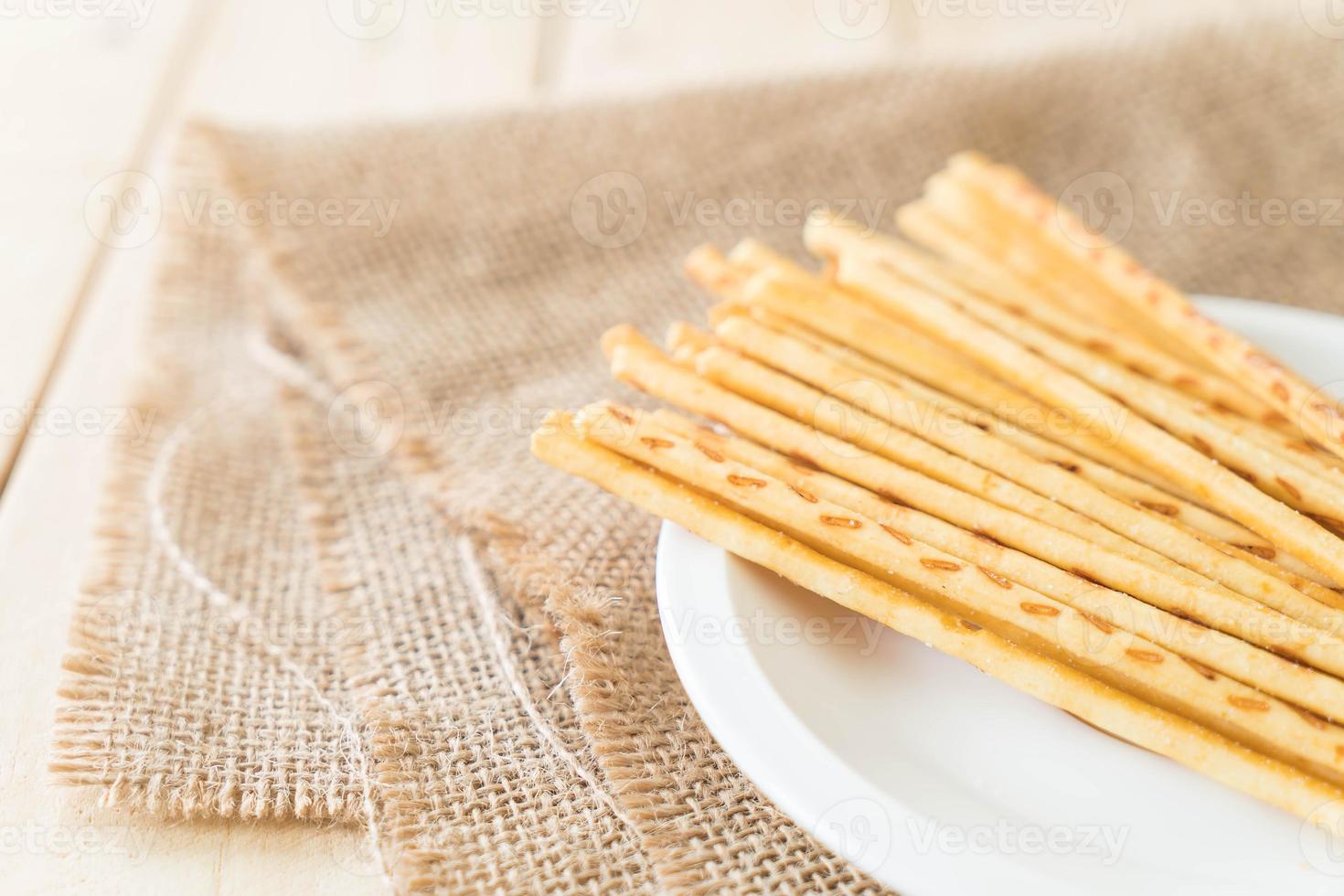 Biscuit stick on white plate photo