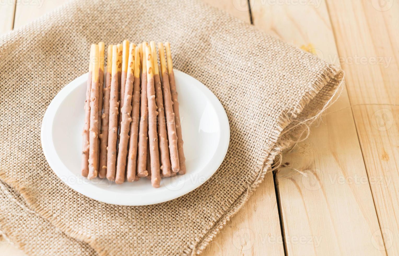 Biscuit stick on white plate photo