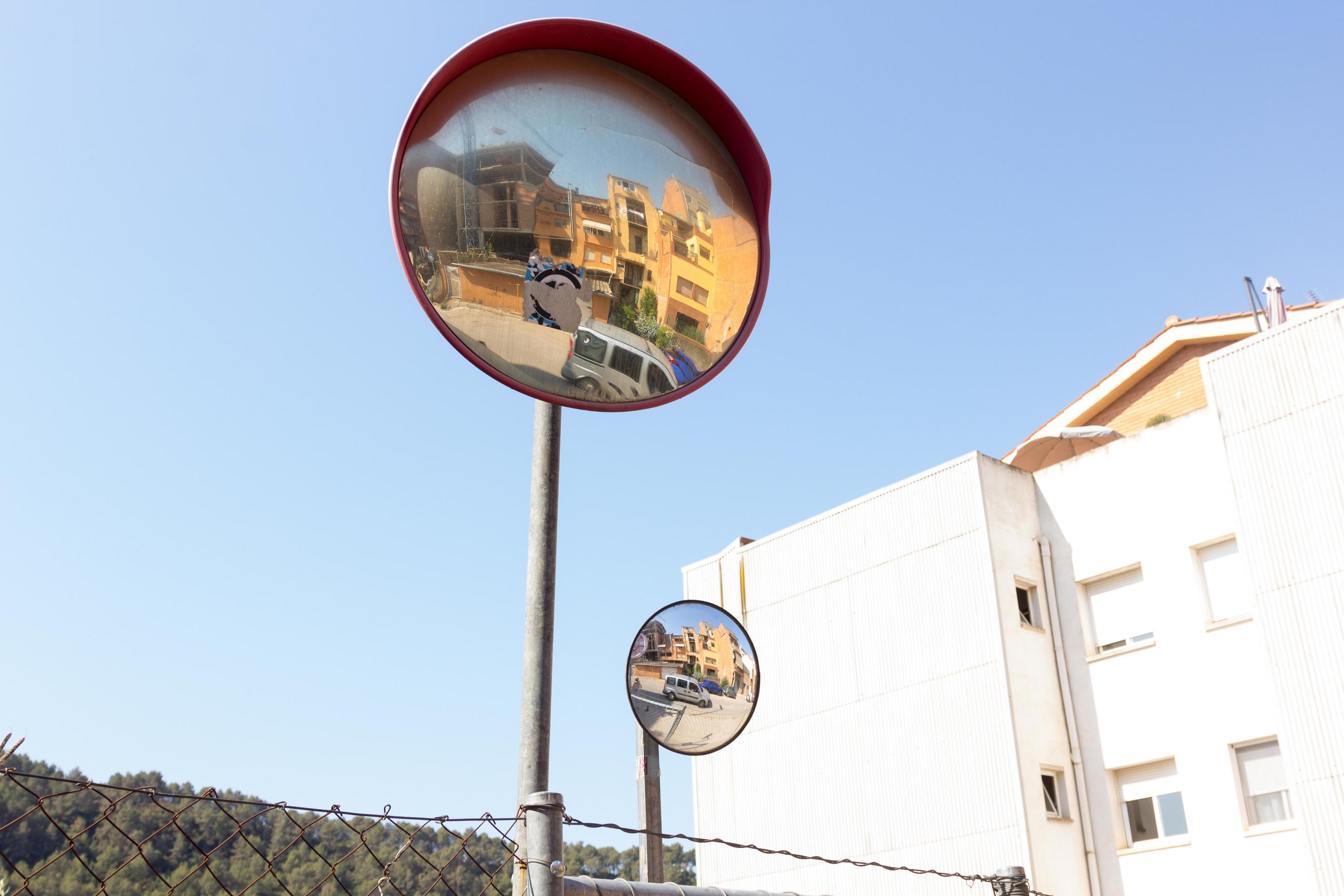Mirrors for drivers to see around corners 3039374 Stock Photo at Vecteezy
