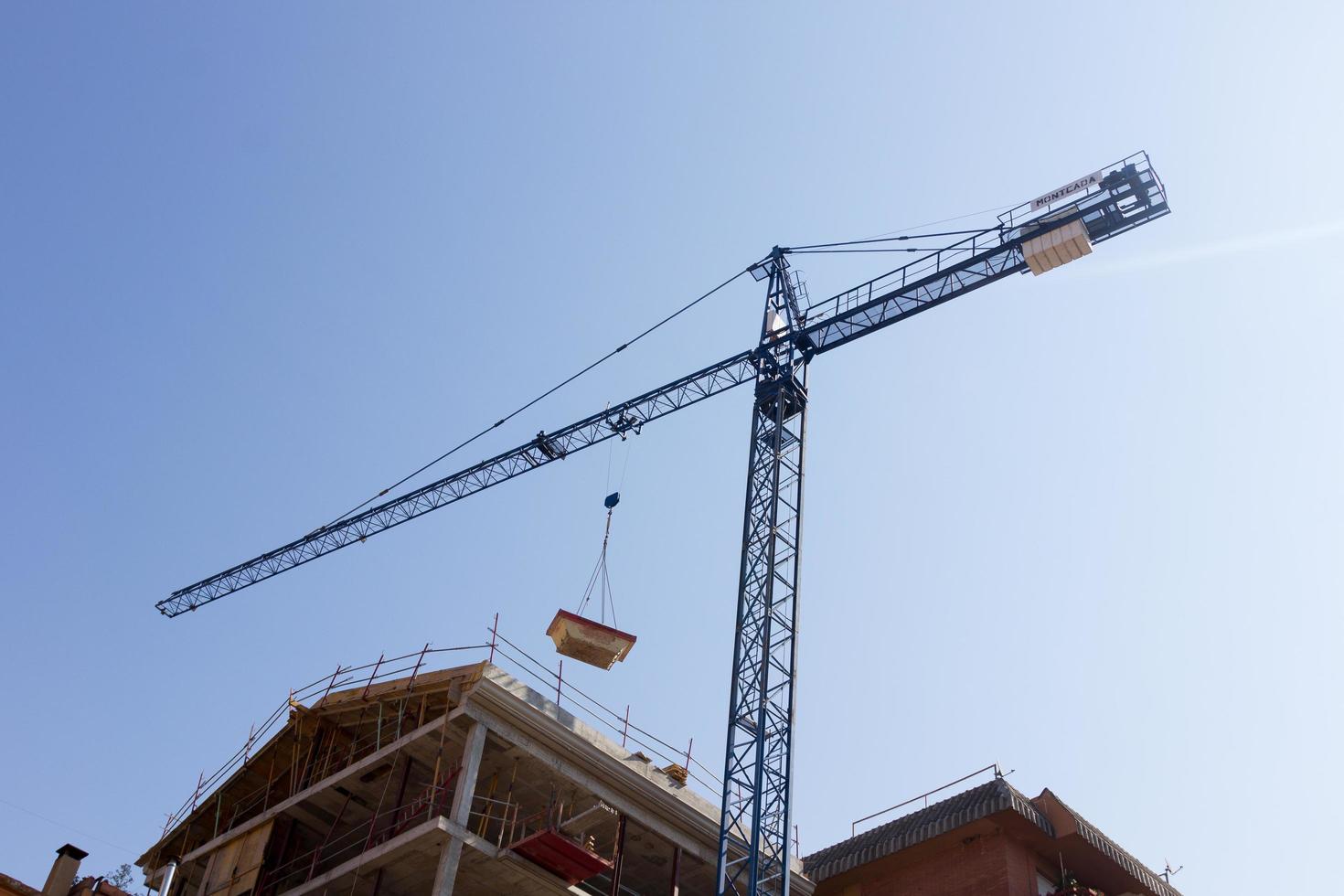 Crane working on a construction site photo