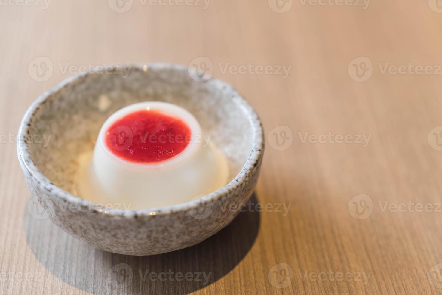 Milk pudding with strawberry sauce - dessert photo