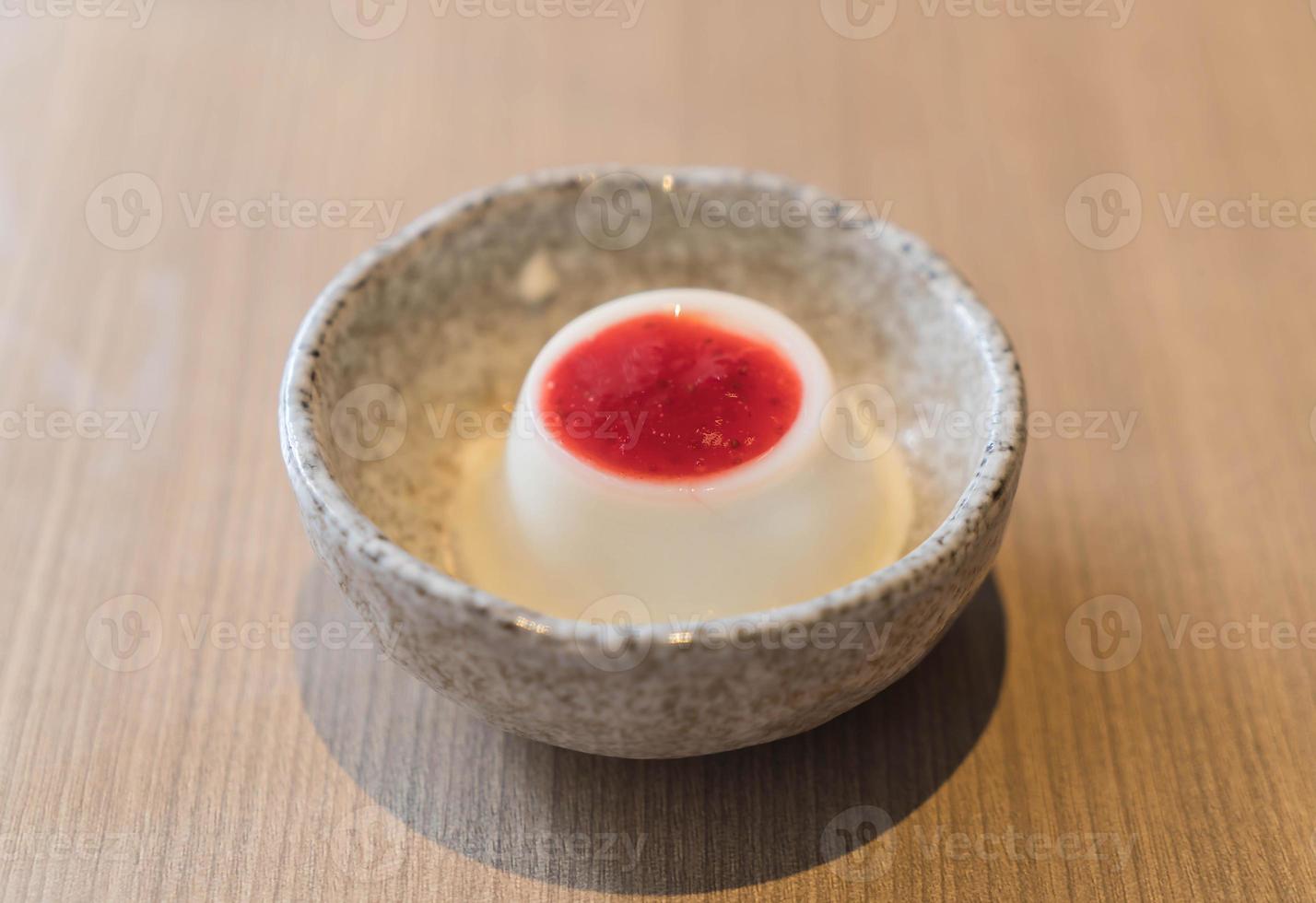 Milk pudding with strawberry sauce - dessert photo