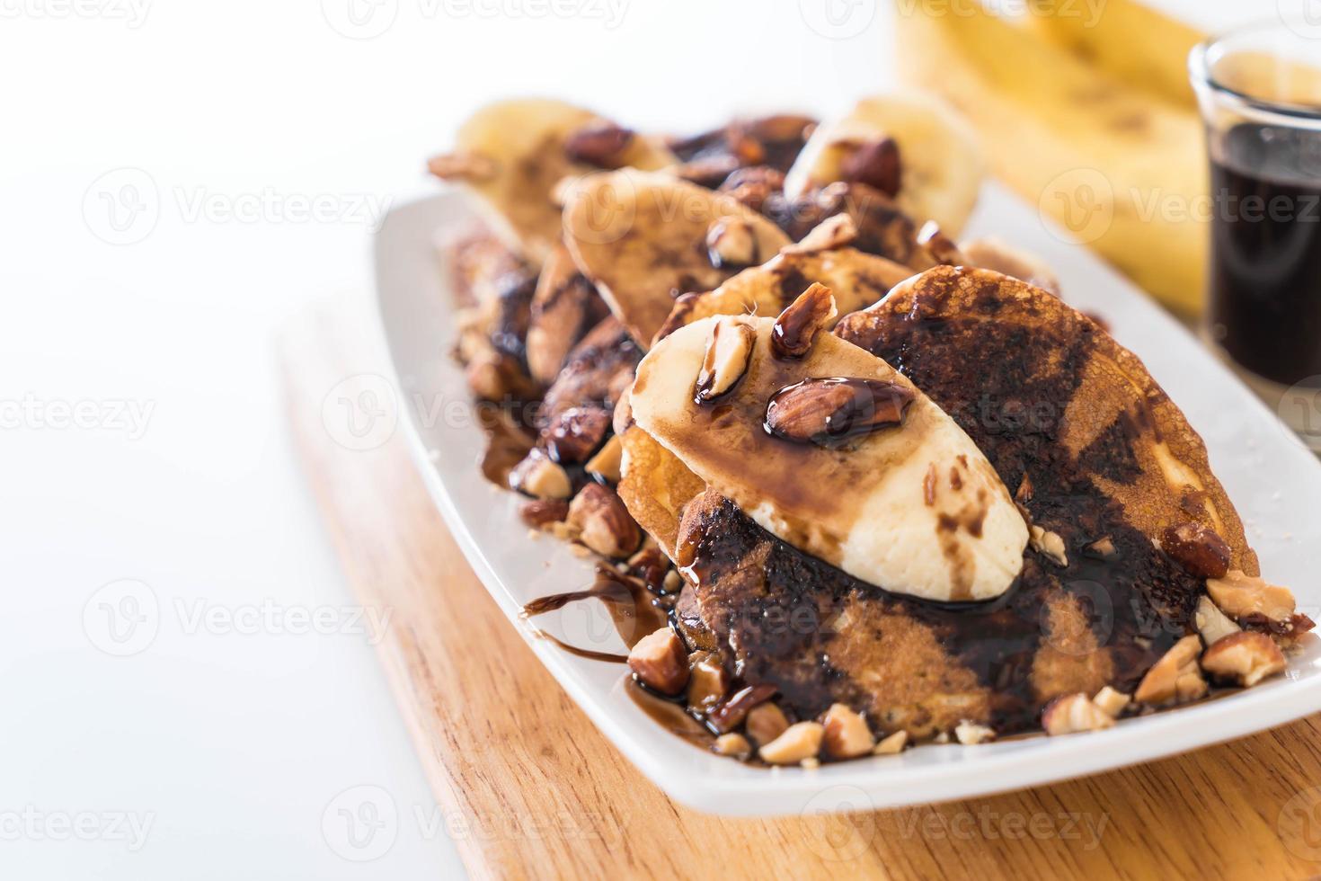 Almond banana pancake with chocolate syrup photo