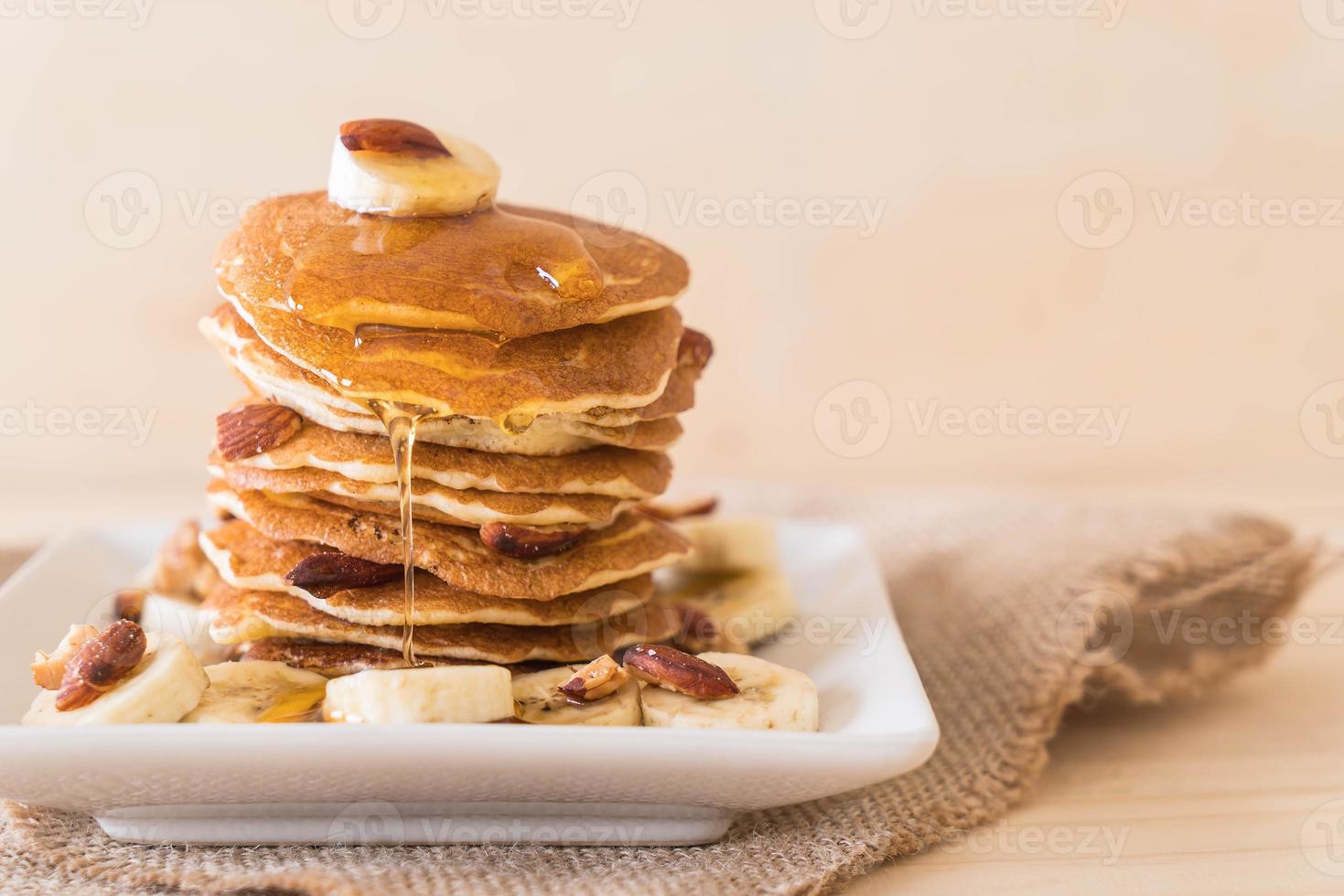 Almond banana pancake with honey photo