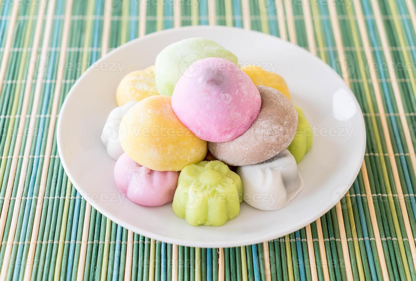 Colorful dessert mochi on white plate photo