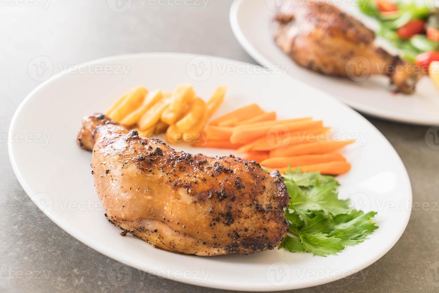 Thigh chicken steak on white background photo