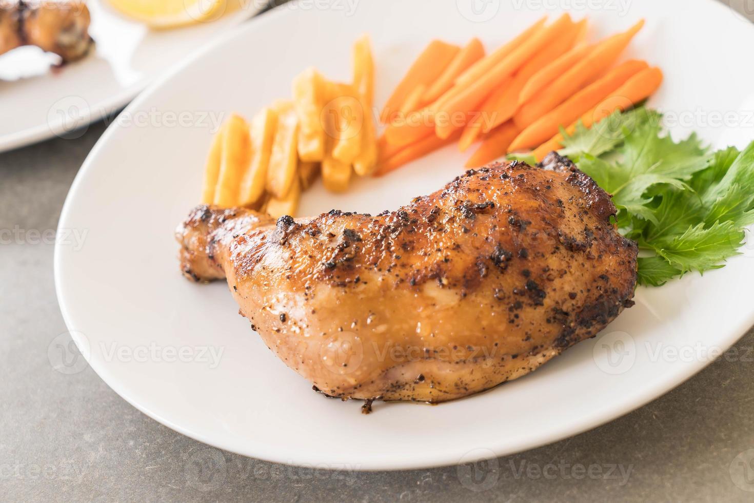 Thigh chicken steak on white background photo