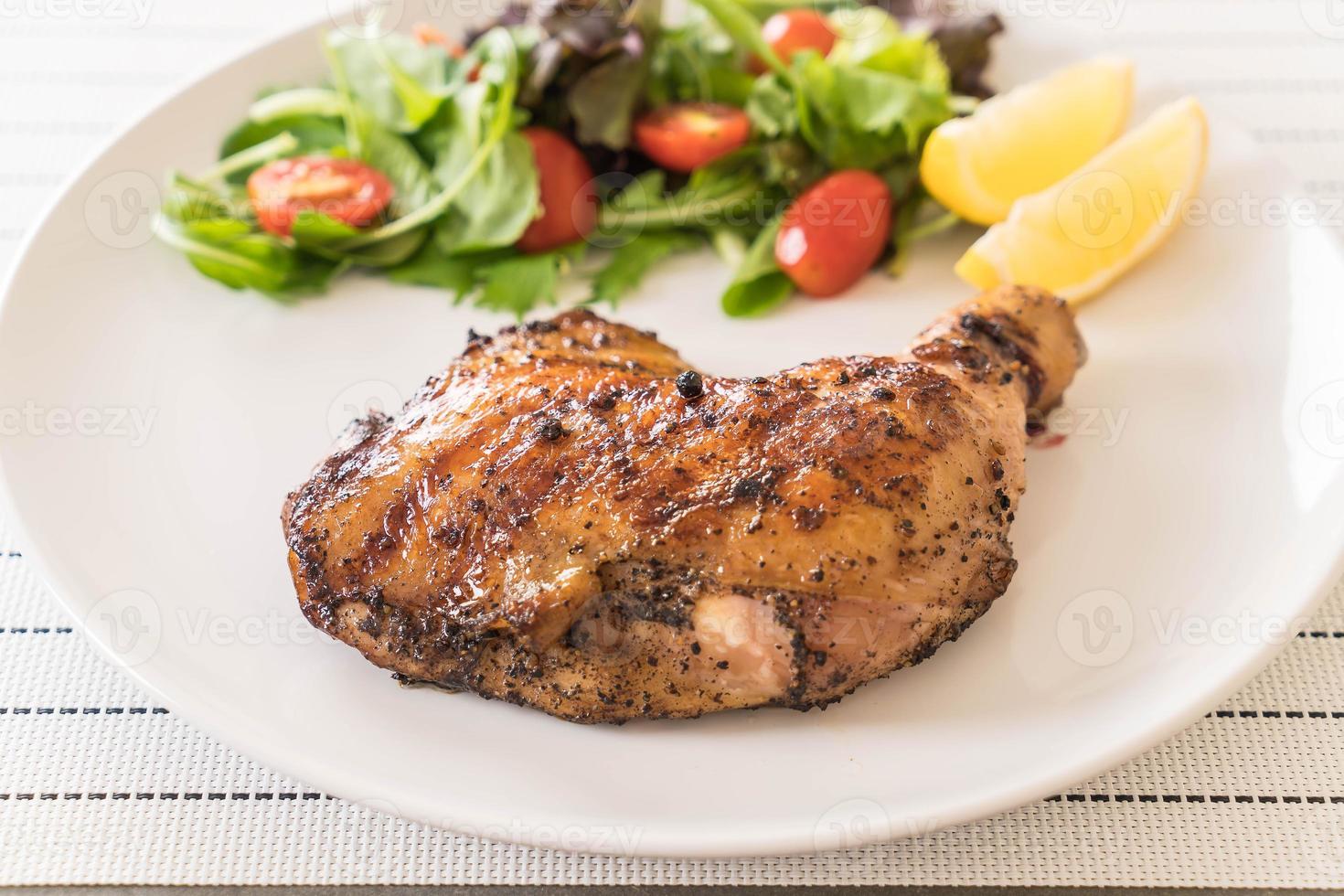 Thigh chicken steak on white background photo