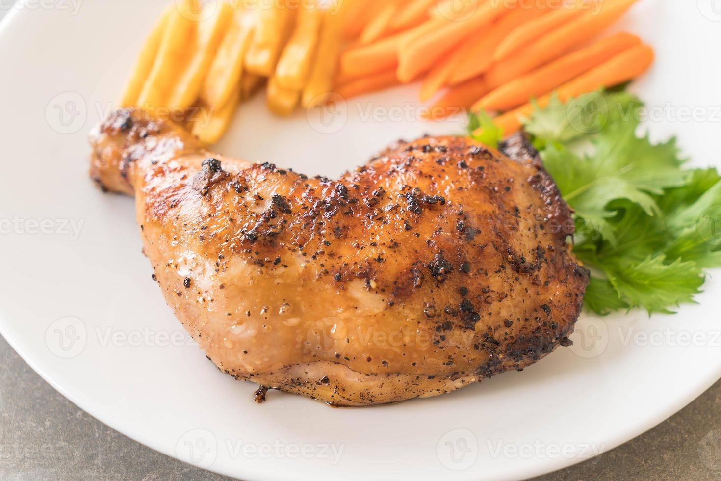 Thigh chicken steak on white background photo