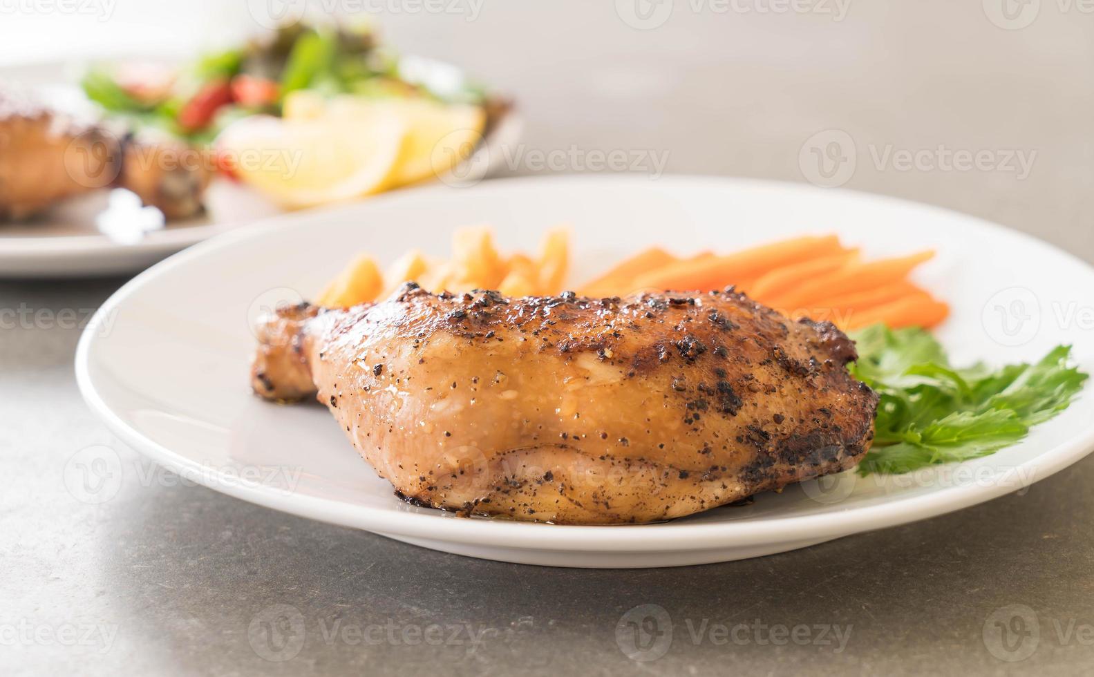 Thigh chicken steak on white background photo