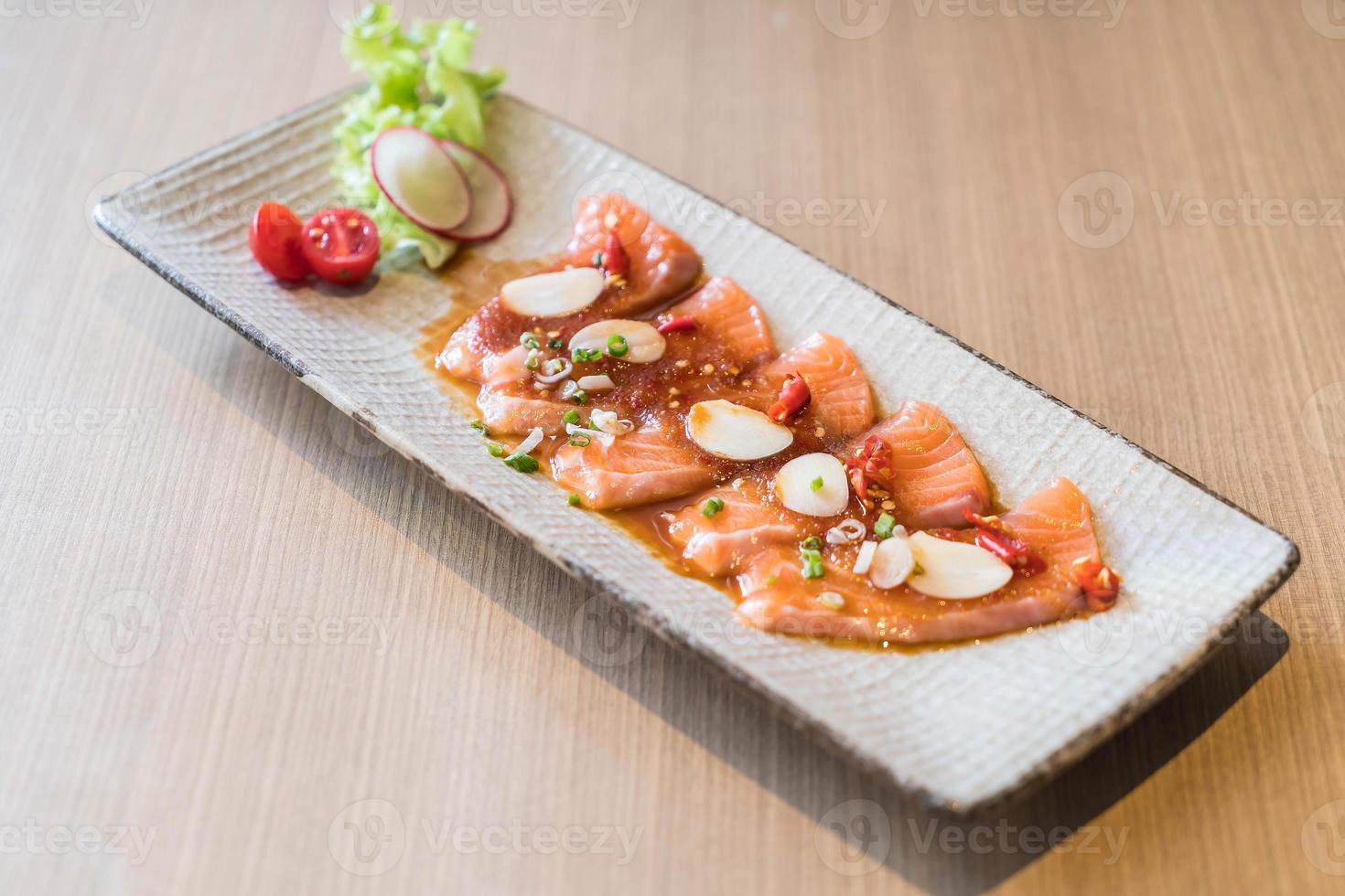 Spicy sliced salmon - fusion food photo