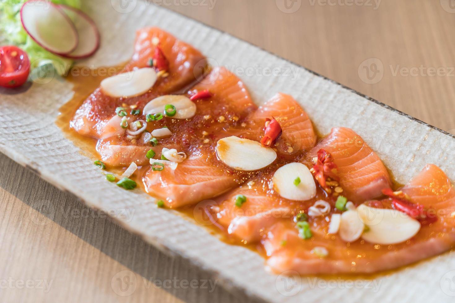 Spicy sliced salmon - fusion food photo